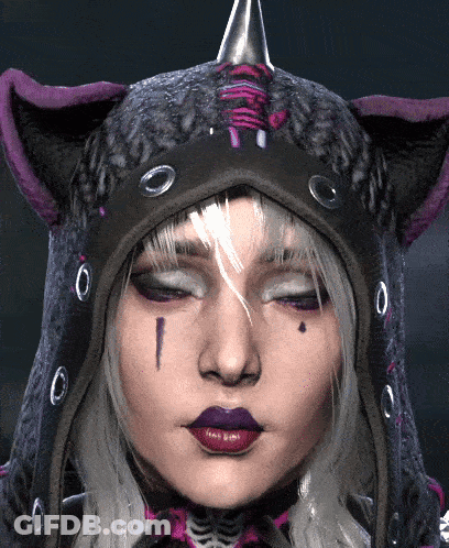 A Close Up Of A Woman 'S Face Wearing A Hooded Cat Hat GIF