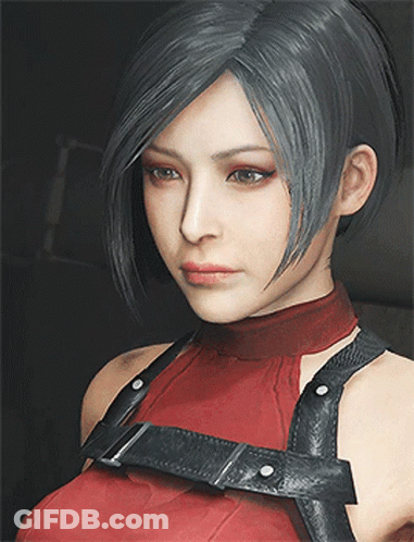 A Close Up Of A Woman 'S Face Wearing A Red Top And Black Harness GIF
