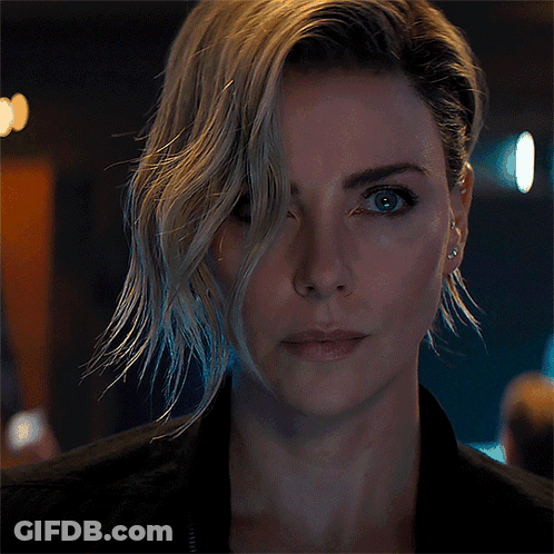 A Close Up Of A Woman 'S Face With A Black Jacket On GIF