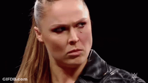 A Close Up Of A Woman 'S Face With A Black Leather Jacket On . GIF