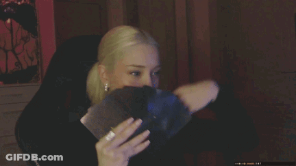 A Close Up Of A Woman 'S Face With A Black Shirt On GIF