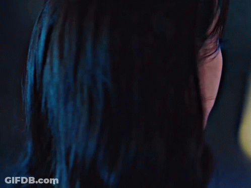 A Close Up Of A Woman 'S Face With A Black Spot On Her Forehead GIF