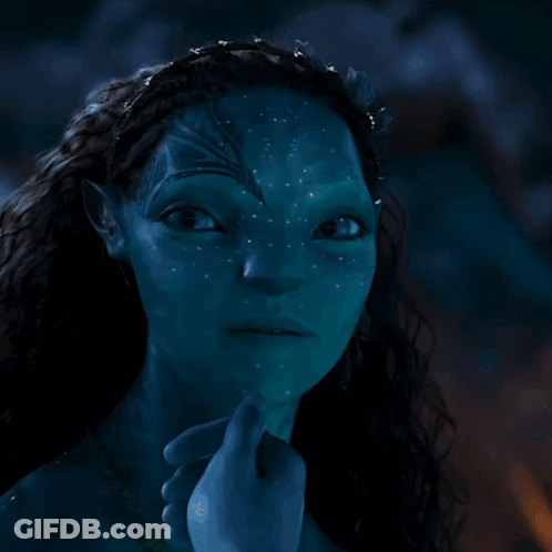 A Close Up Of A Woman 'S Face With A Blue Background GIF