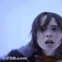 A Close Up Of A Woman 'S Face With A Blue Background GIF