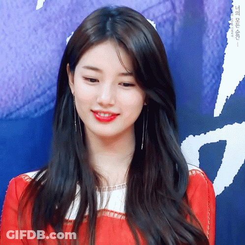 A Close Up Of A Woman 'S Face With A Blue Background That Says ' I ' On It GIF