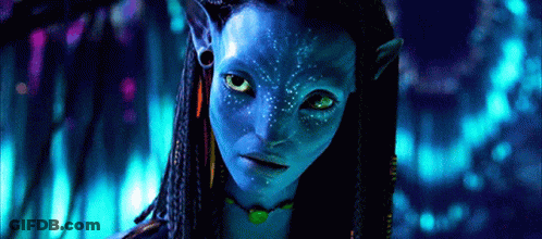 A Close Up Of A Woman 'S Face With A Blue Face Paint GIF