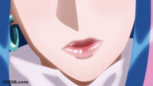 A Close Up Of A Woman 'S Face With A Blue Hair GIF