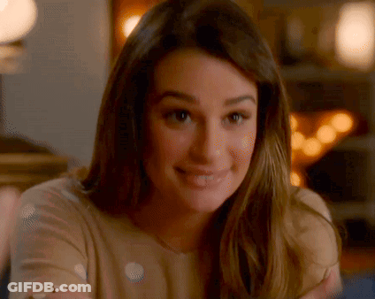 A Close Up Of A Woman 'S Face With A Blurred Background . GIF