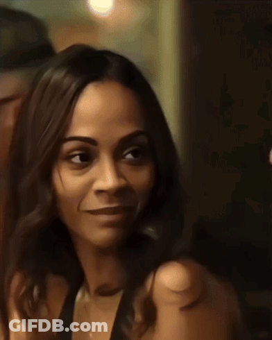 A Close Up Of A Woman 'S Face With A Blurred Background GIF