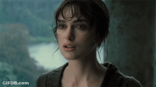A Close Up Of A Woman 'S Face With A Blurred Background GIF