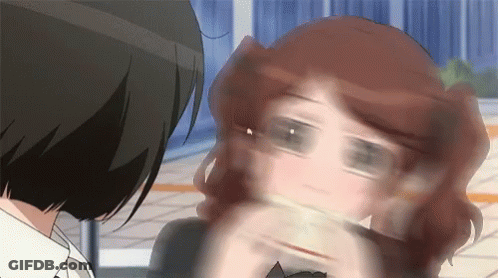A Close Up Of A Woman 'S Face With A Blurred Background GIF