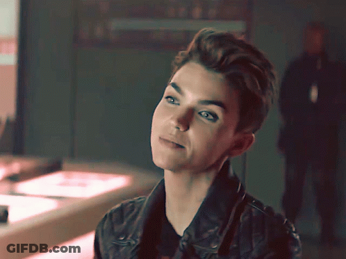 A Close Up Of A Woman 'S Face With A Blurred Background GIF