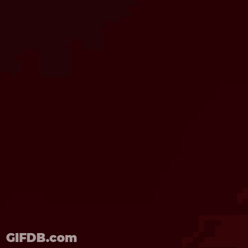 A Close Up Of A Woman 'S Face With A Blurry Background And A Hand Behind Her . GIF