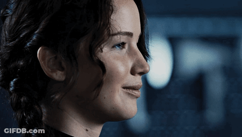 A Close Up Of A Woman 'S Face With A Braid GIF