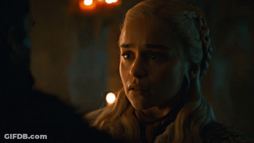 A Close Up Of A Woman 'S Face With A Braided Hair Style GIF