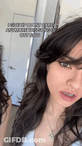 A Close Up Of A Woman 'S Face With A Caption That Says I Give Up I Don T Care Anymore GIF
