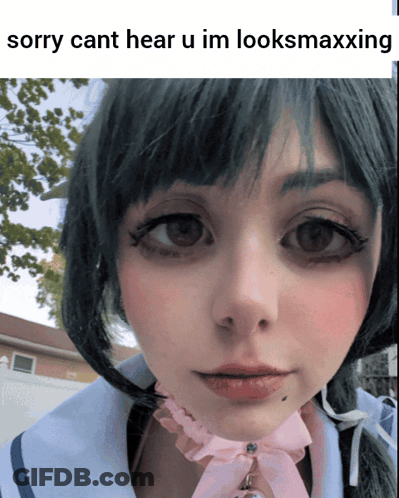 A Close Up Of A Woman 'S Face With A Caption That Says Sorry Cant Hear U Im Looksmaxxing GIF