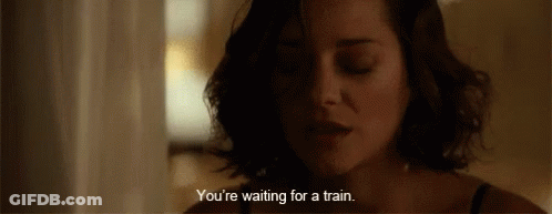 A Close Up Of A Woman 'S Face With A Caption That Says You 'Re Waiting For A Train GIF