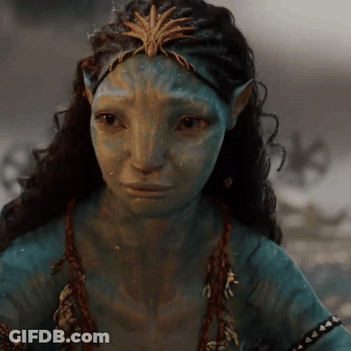 A Close Up Of A Woman 'S Face With A Crown On It GIF
