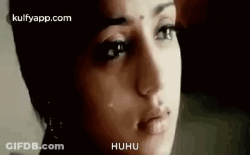 A Close Up Of A Woman 'S Face With A Crying Look On Her Face . GIF