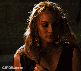 A Close Up Of A Woman 'S Face With A Dark Background GIF