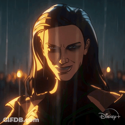 A Close Up Of A Woman 'S Face With A Disney Logo In The Background GIF