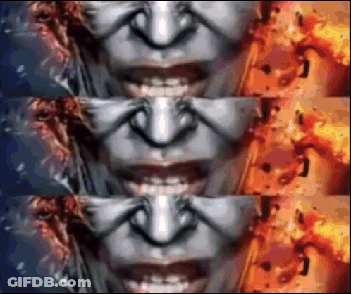 A Close Up Of A Woman 'S Face With A Fire Background GIF