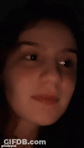 A Close Up Of A Woman 'S Face With A Gifsdayrol Watermark GIF