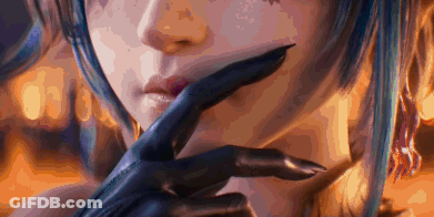 A Close Up Of A Woman 'S Face With A Glove On Her Hand . GIF