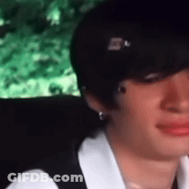Close Up Of Woman's Face With Green Background GIF