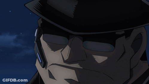 A Close Up Of A Woman 'S Face With A Gun In The Background GIF