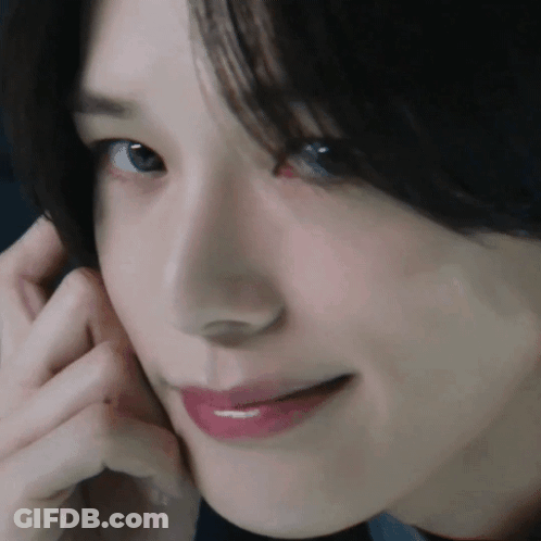 Woman With Hand On Face GIF