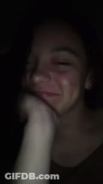 A Close Up Of A Woman 'S Face With A Hand On Her Face GIF