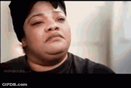 A Close Up Of A Woman 'S Face With A Hat On . GIF