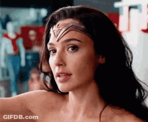 A Close Up Of A Woman 'S Face With A Headband On . GIF