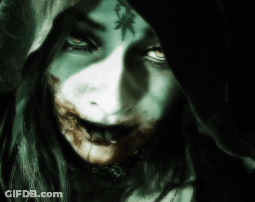 A Close Up Of A Woman 'S Face With A Hood On Her Head GIF