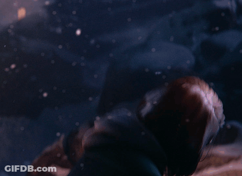 A Close Up Of A Woman 'S Face With A Hood On GIF