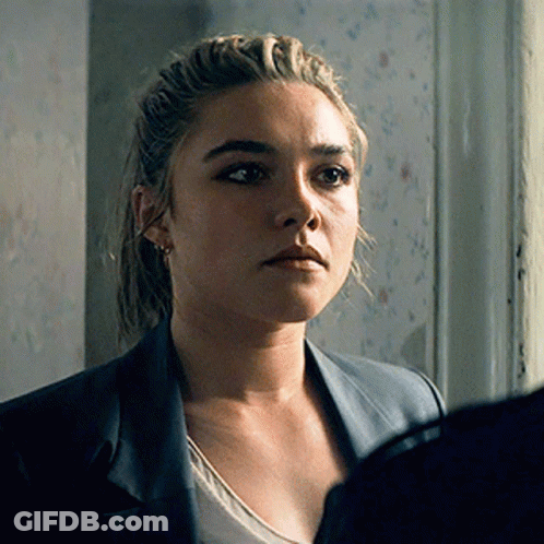 A Close Up Of A Woman 'S Face With A Jacket On GIF