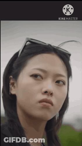 A Close Up Of A Woman 'S Face With A Kinemaster Logo Behind Her GIF