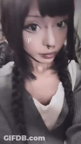 A Close Up Of A Woman 'S Face With A Letter P On Her Face GIF