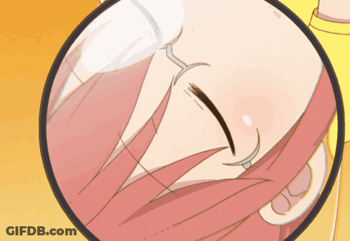 A Close Up Of A Woman 'S Face With A Magnifying Glass GIF