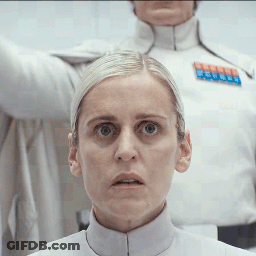 Close Up Of Woman's Face With Man In Background GIF