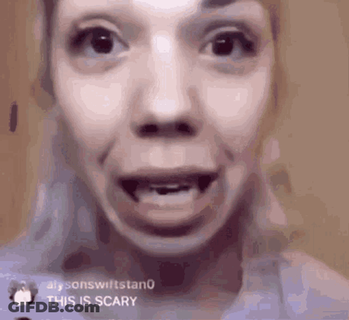 A Close Up Of A Woman 'S Face With A Missing Tooth And A Caption That Says `` This Is Scary '' . GIF
