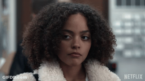 Close Up Of Woman With Netflix Logo Behind GIF