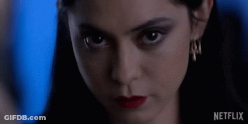 Close Up Of Woman's Face With Netflix Logo GIF