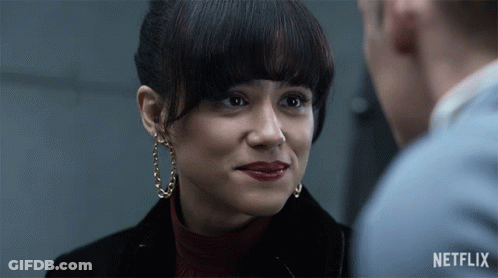 A Close Up Of A Woman 'S Face With A Netflix Logo On The Bottom GIF