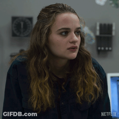A Close Up Of A Woman 'S Face With A Netflix Logo On The Bottom GIF
