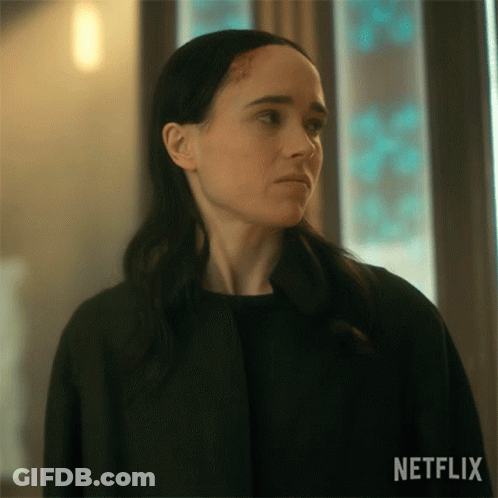 A Close Up Of A Woman 'S Face With A Netflix Logo On The Bottom GIF