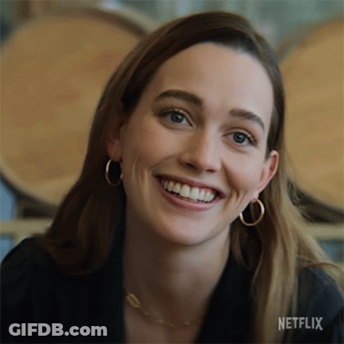 A Close Up Of A Woman 'S Face With A Netflix Logo On The Bottom GIF