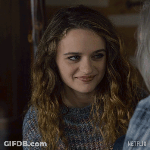 A Close Up Of A Woman 'S Face With A Netflix Logo On The Bottom GIF